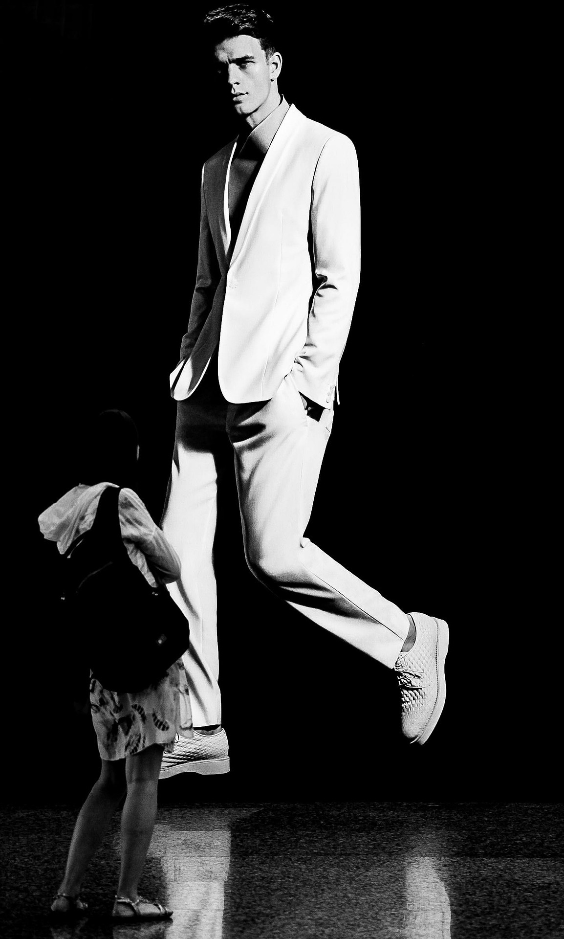 A male model in a fashionable coat.